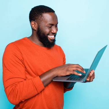 person looking at laptop smiling